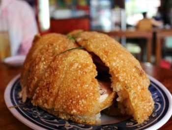 A dish you've probably never had: Poached chicken encrusted in sticky rice and deep fried.